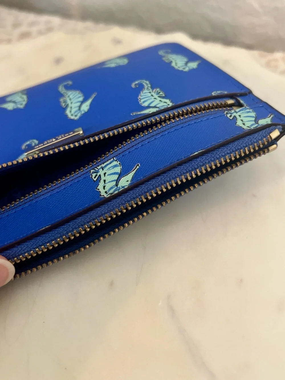 kate spade cobalt blue seahorse wristlet clutch